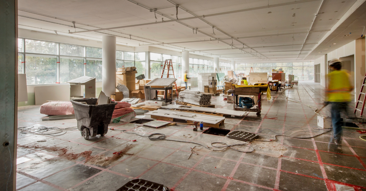 construction workers cleaning up office building for new commercial construction