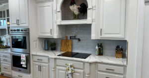white shaker cabinets with gold hardware