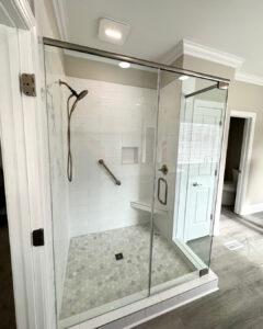 matte black fixtures on tiled shower wall