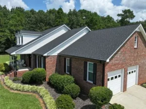 aerial view of fresh charcoal black shingles with detailed step and counter flashing