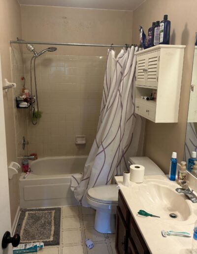 outdated bathroom in charlotte nc with beige tile and old vanity before remodel