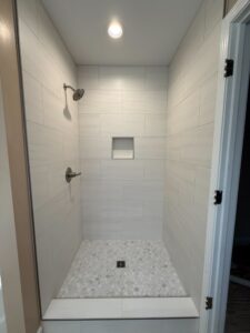 remodeled walk in shower with tile