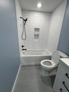 new subway tile shower in remodeled bathroom